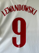 White Poland home soccer jersey with red 'LEWANDOWSKI' and number 9