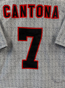 Football shirt back with 'CANTONA' text and red number '7'