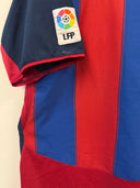 Navy and red striped football shirt sleeve with LFP badge