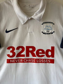 White home football shirt with 32Red sponsor and "Never Chase Losses"