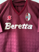 Maroon V-neck soccer jersey with club crest and Beretta sponsor