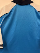 Light blue football shirt showing side panel and black-and-white sleeve trim