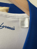 White soccer jersey collar with blue trim and Warner's label on inside