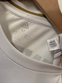 White football jersey with Adidas logo, size label, and collar hem detail