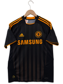 Black football shirt on hanger with orange trim and SAMSUNG sponsor