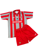 Red and gray striped home kit jersey with red shorts, Puma logo and BOSSINI text