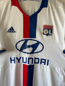 Home soccer shirt with red/blue stripe, HYUNDAI sponsor, and Olympique Lyonnais crest