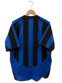 Back view of blue and black vertically striped football jersey on hanger