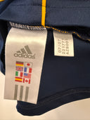 Adidas LA Galaxy away shirt collar with size tag and navy knit fabric.