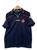 Navy soccer jersey front with red trim, Lotto logo, and red crest patch