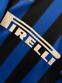 Pirelli sponsor print on blue and black vertically striped football jersey