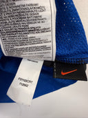 Blue football shirt care label on inner neckline