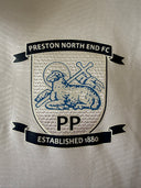 White football shirt crest badge with blue lion and PP logo