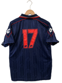 Navy soccer shirt back with red-outlined number 17 and shoulder patches