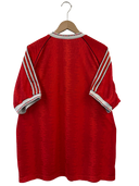 Red football shirt back view with white adidas shoulder stripes and striped sleeve cuffs