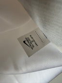 White soccer jersey fabric with stitched care label