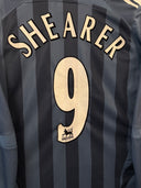 Dark blue striped soccer jersey with Shearer 9 on chest