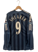 Dark blue striped soccer jersey back with Shearer 9 and club crest