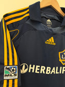 LA Galaxy away shirt side view with adidas logo, Herbalife sponsor, and stripes.