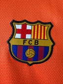 FC Barcelona shield crest patch on orange jersey