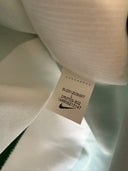 Sporting CP home shirt size label on white fabric