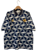 Navy football shirt with geometric print, Umbro logo and association crest