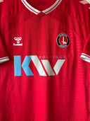 Red home football shirt with white V-neck trim, Hummel logo, Charlton crest, and KAV sponsor