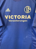 Blue Schalke home football shirt with adidas, VICTORIA, Versicherungen, and S04 crest