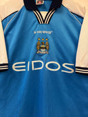 Light blue football jersey with le coq sportif logo, club crest, and EIDOS sponsor