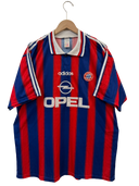 Front football shirt with red and blue vertical stripes, adidas logo, Opel sponsor, crest