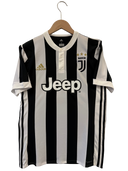 Juventus home football shirt on hanger, black and white stripes with Jeep sponsor logo