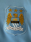 Manchester City 2014/15 Home Shirt Long Sleeve 611054-489 | Close up badge